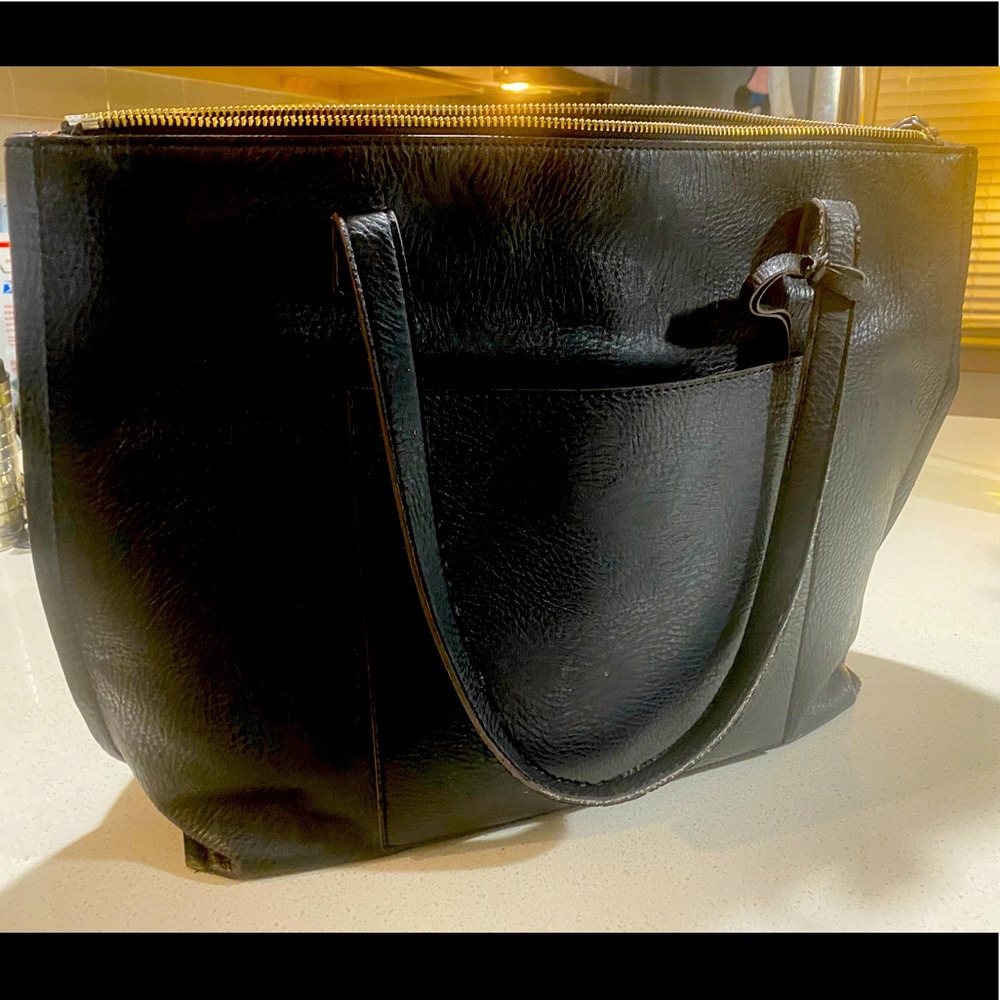 Beautiful leather bag, fits laptop and all you need.